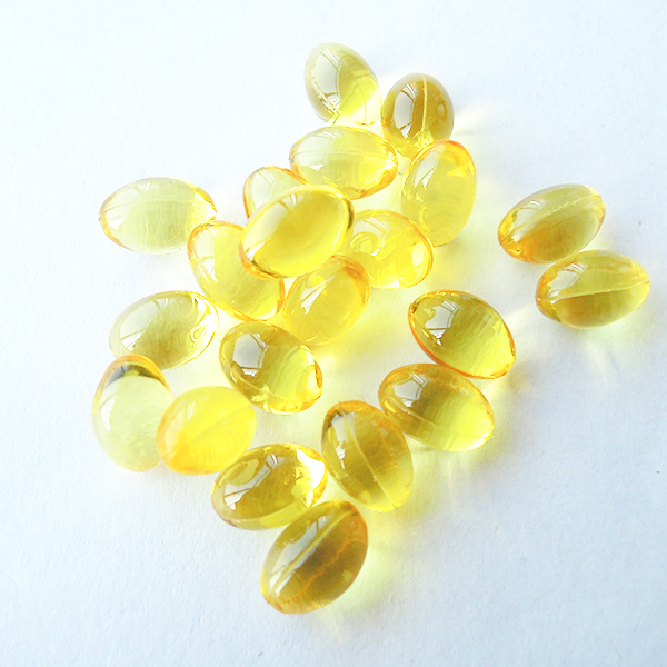 Transparent golden softgel capsules